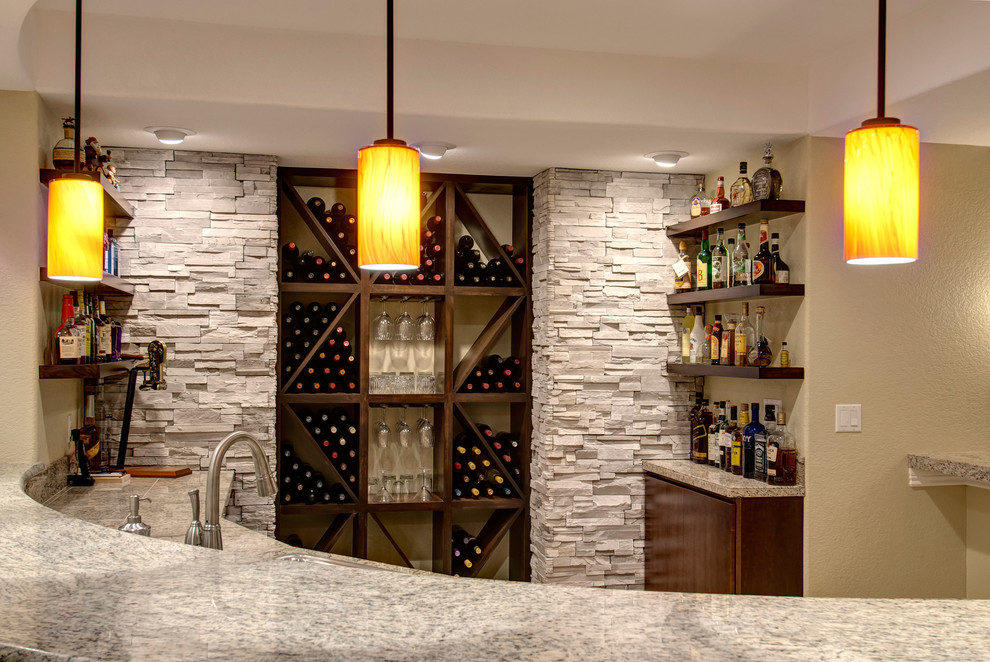 Large transitional wine cellar in Denver with beige floor and marble floors.