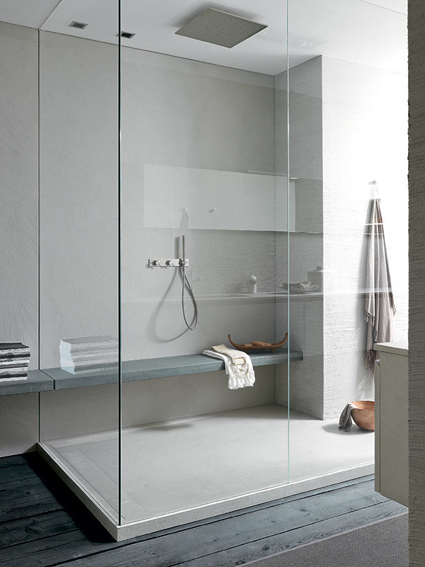 Inspiration for a modern master bathroom in Boston with grey cabinets, a drop-in tub, an open shower, grey walls, an integrated sink and an open shower.