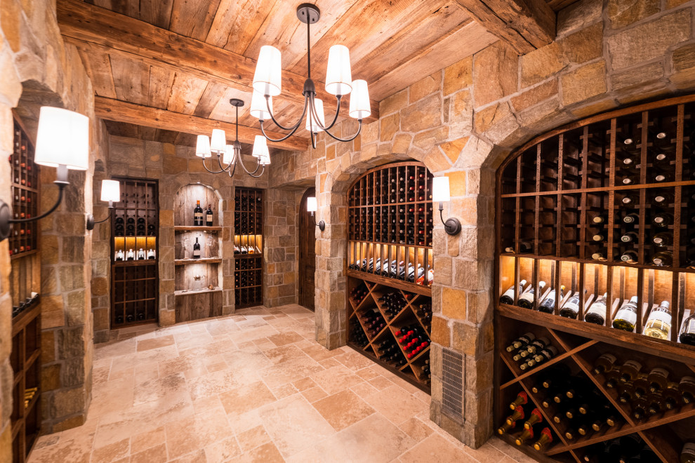 Design ideas for a medium sized traditional wine cellar in New York with travertine flooring, storage racks and beige floors.