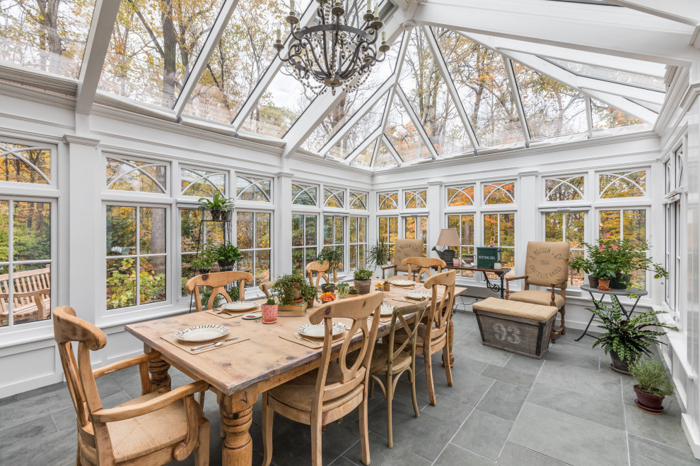Photo of a large traditional sunroom in Indianapolis with travertine floors, a glass ceiling, no fireplace and grey floor.