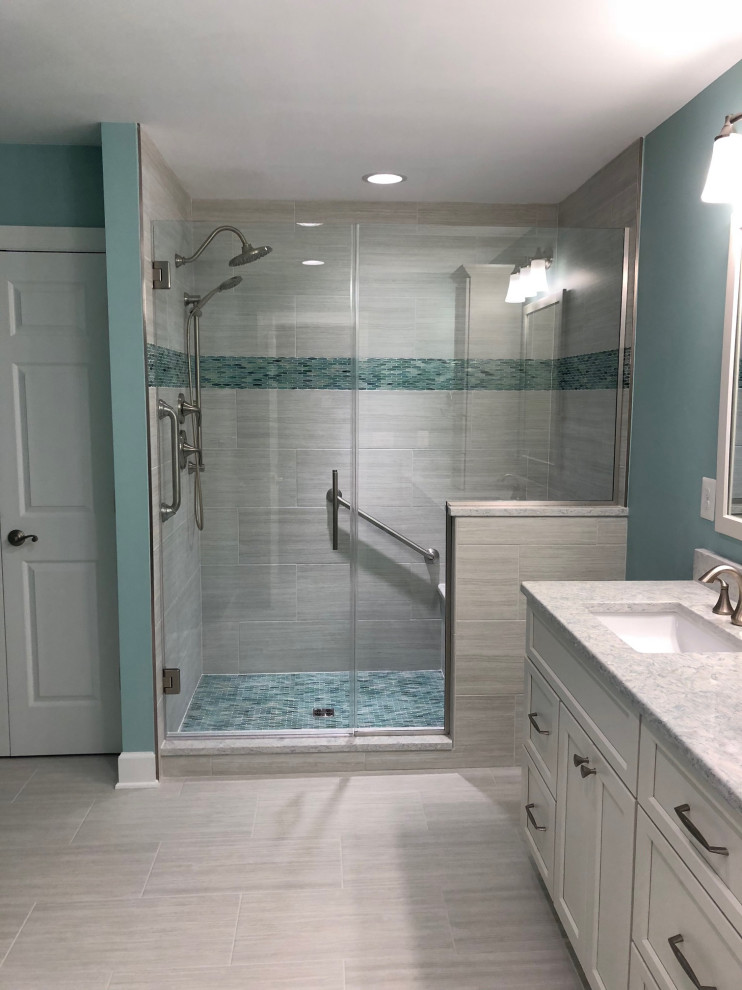 Photo of a contemporary ensuite bathroom in Baltimore with shaker cabinets, white cabinets, a submerged sink, a shower bench, double sinks and a built in vanity unit.