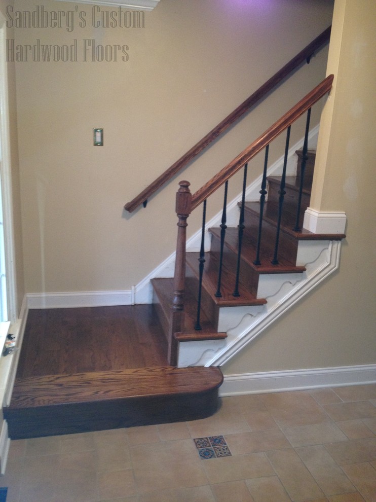 This is an example of a small traditional wood straight staircase in Philadelphia with wood risers.