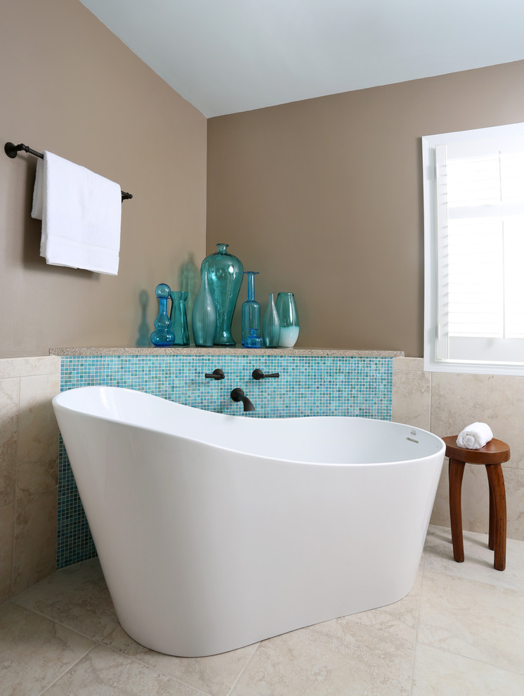 Design ideas for a mid-sized contemporary master bathroom in Chicago with a freestanding tub, blue tile, mosaic tile and beige walls.