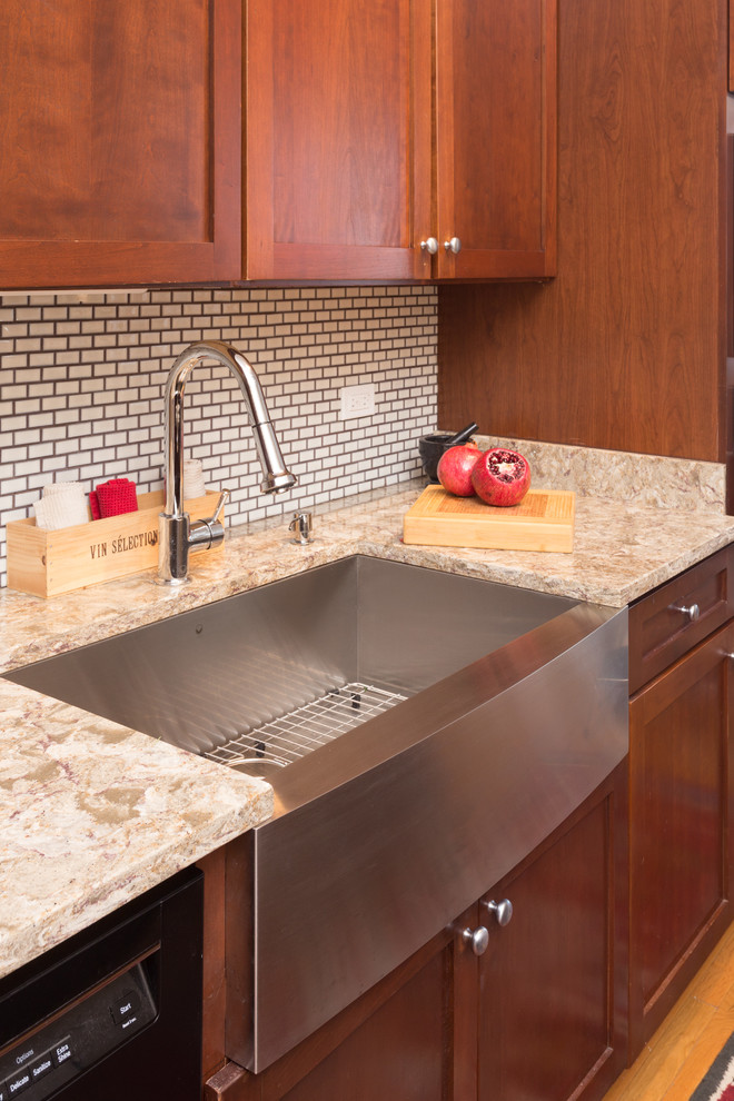 Enclosed kitchen - mid-sized contemporary galley enclosed kitchen idea in Chicago with an undermount sink, granite countertops, white backsplash, cement tile backsplash and stainless steel appliances