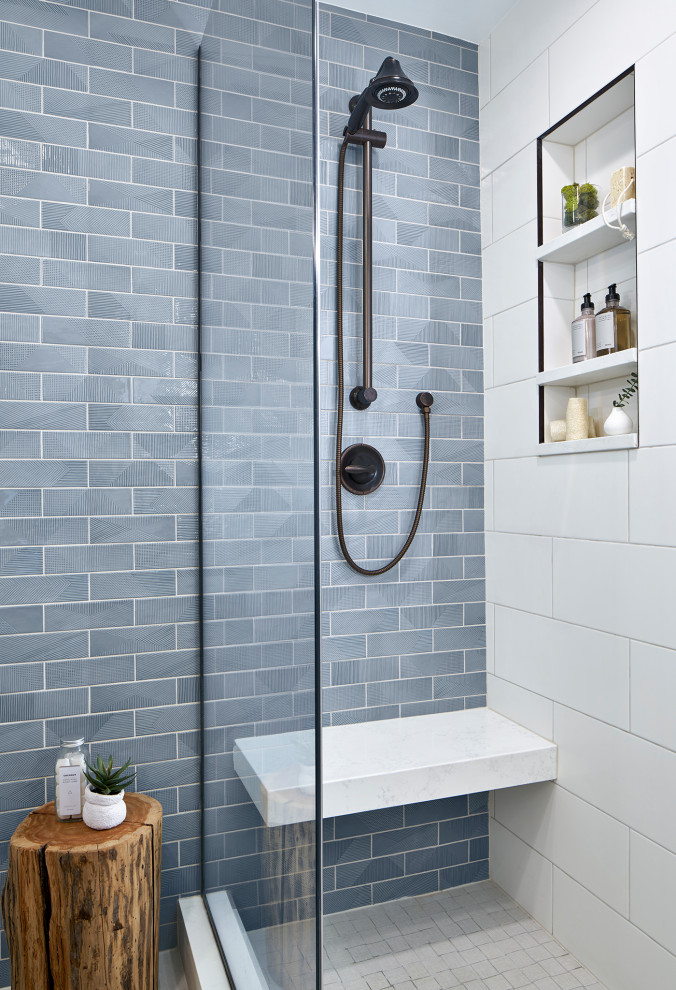 This is an example of a mid-sized transitional master bathroom in Chicago with blue tile, white floor, shaker cabinets, light wood cabinets, an alcove shower, ceramic tile, porcelain floors, an undermount sink, engineered quartz benchtops, a hinged shower door, white benchtops and a double vanity.