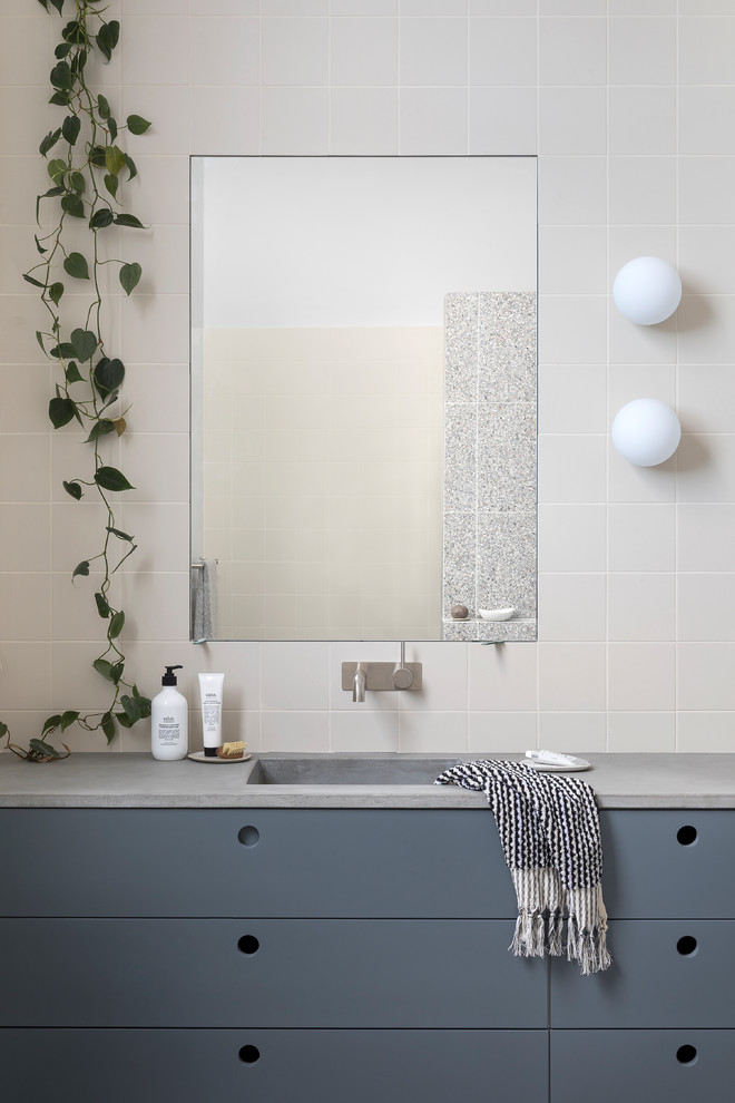 Design ideas for a large contemporary kids bathroom in Melbourne with a freestanding tub, an open shower, terrazzo floors, an integrated sink, concrete benchtops, grey floor, an open shower and grey benchtops.