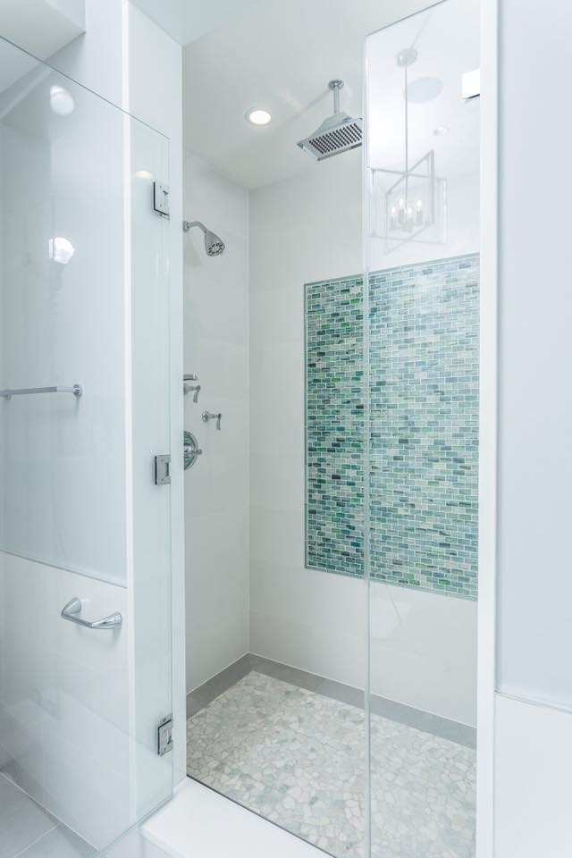 Inspiration for a mid-sized transitional master bathroom in New York with flat-panel cabinets, beige cabinets, an alcove shower, beige walls, medium hardwood floors, a vessel sink, engineered quartz benchtops, brown floor, a hinged shower door, blue tile, green tile and mosaic tile.