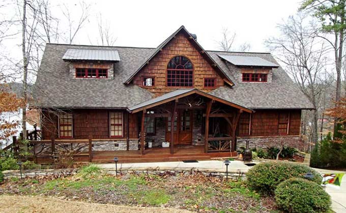 This is an example of a mid-sized country three-storey exterior in Atlanta with mixed siding.