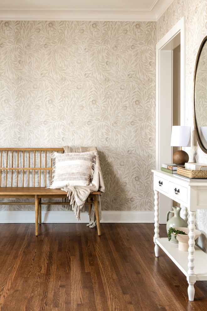 This is an example of a transitional entryway in St Louis with wallpaper.