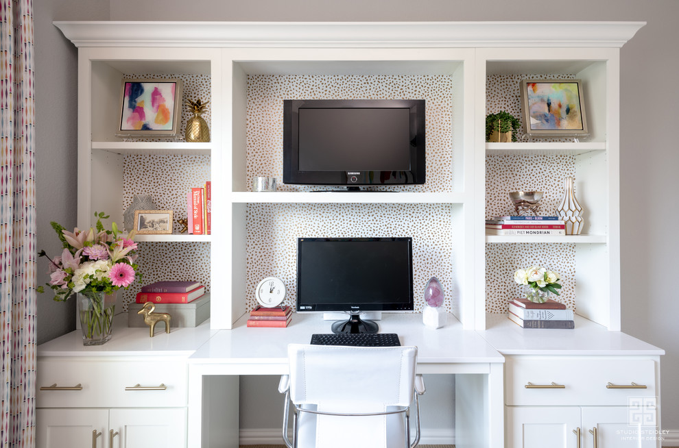 Inspiration for a mid-sized eclectic craft room in Dallas with grey walls, carpet, a built-in desk and beige floor.