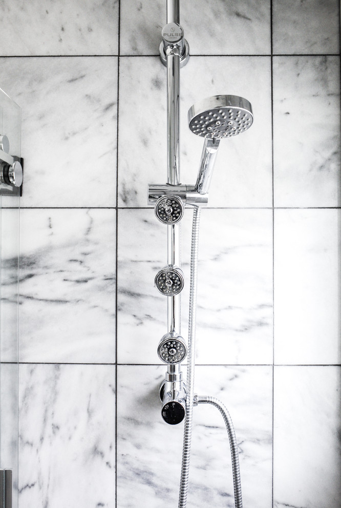 Inspiration for a small transitional master gray tile and marble tile marble floor and gray floor alcove bathtub remodel with furniture-like cabinets, white cabinets, a two-piece toilet, gray walls, a console sink, quartz countertops and white countertops