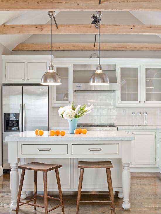Inspiration for a mid-sized contemporary l-shaped open plan kitchen in Boston with an undermount sink, recessed-panel cabinets, white cabinets, marble benchtops, white splashback, ceramic splashback, stainless steel appliances, medium hardwood floors and with island.