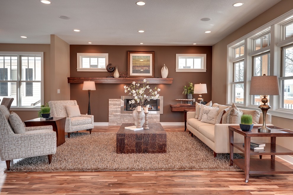 Inspiration for a transitional living room in Minneapolis with brown walls.