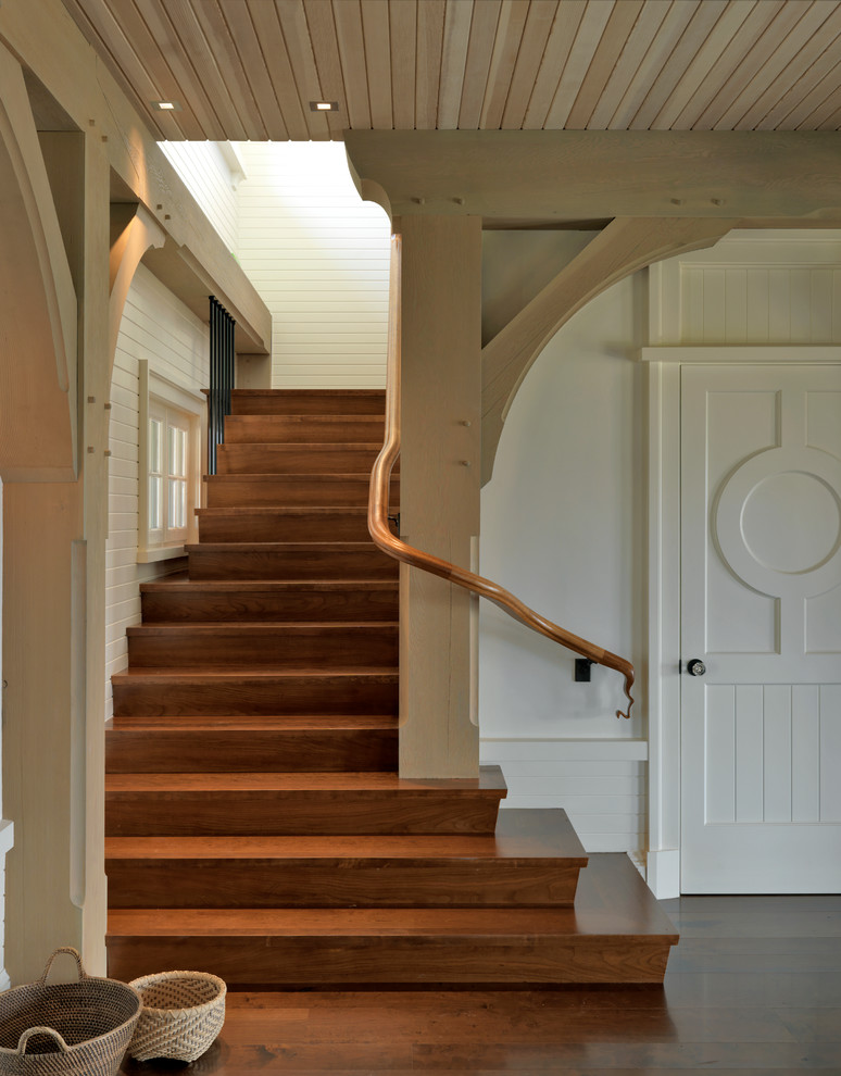 Inspiration for a beach style wood staircase in Boston with wood risers.