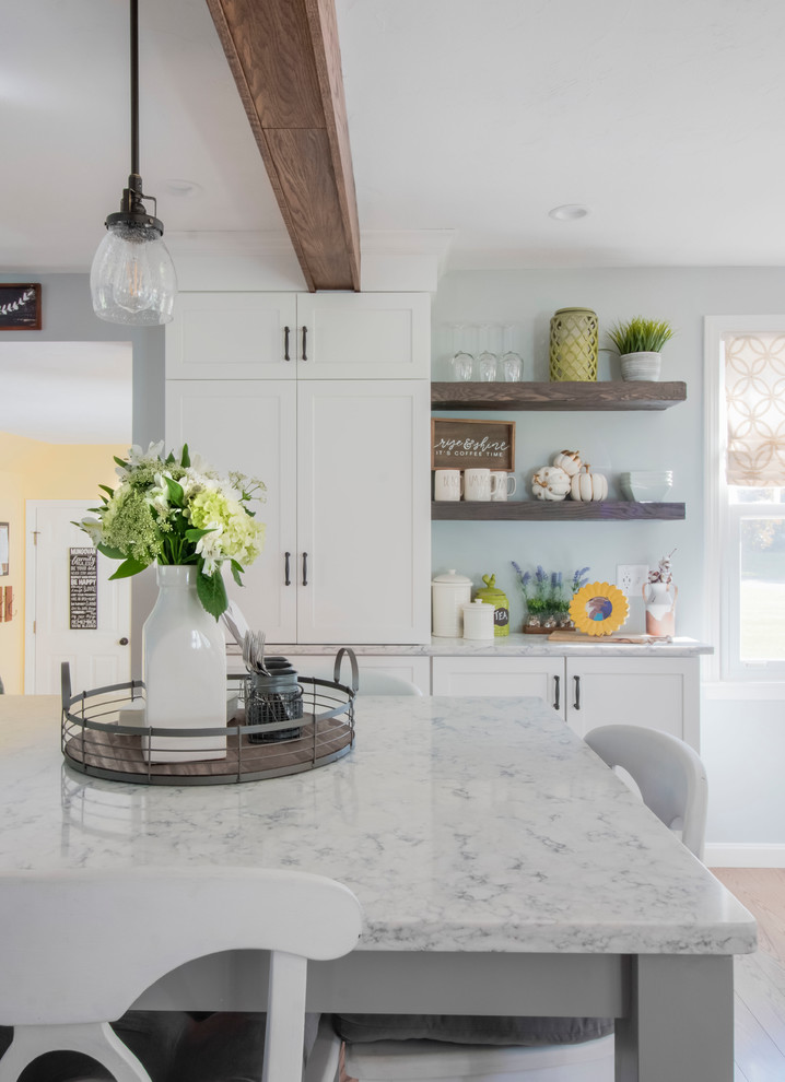 Design ideas for a country eat-in kitchen in Boston with shaker cabinets, white cabinets, grey splashback, subway tile splashback, stainless steel appliances, with island and grey benchtop.