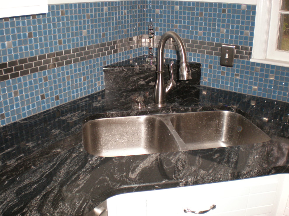 Example of a mid-sized eclectic u-shaped ceramic tile eat-in kitchen design with an undermount sink, shaker cabinets, white cabinets, granite countertops, blue backsplash, mosaic tile backsplash and stainless steel appliances