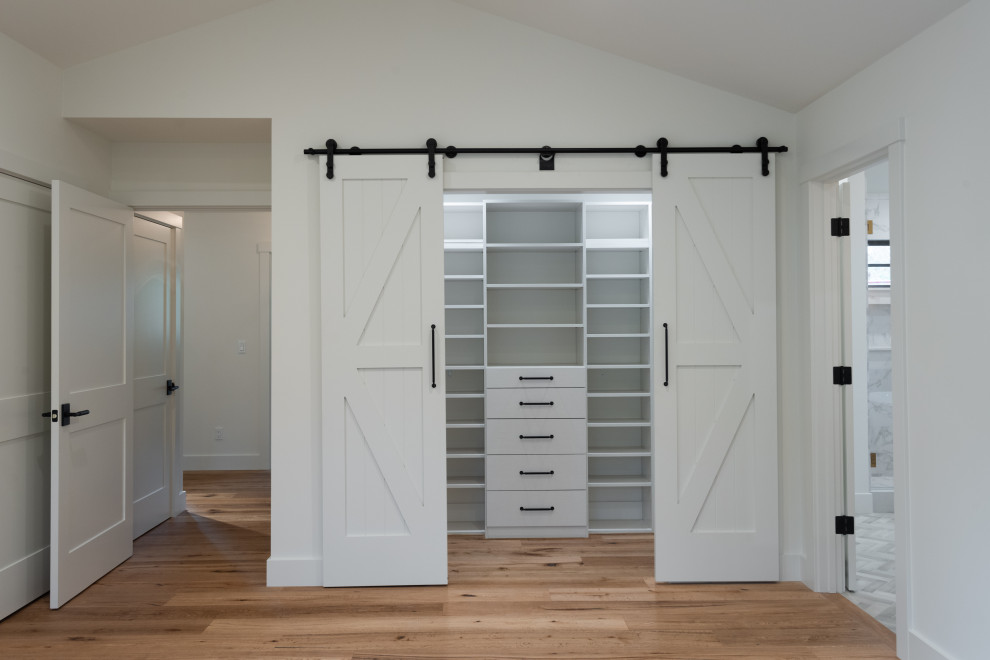 Example of a country gender-neutral built-in closet design in San Francisco