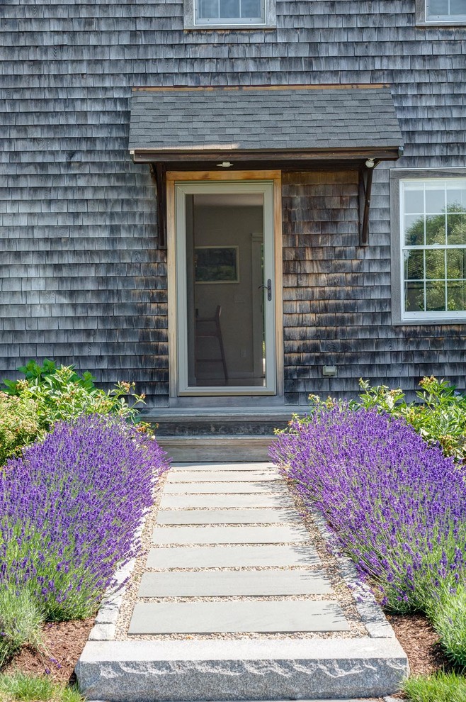 This is an example of a country entryway in Providence with a single front door.