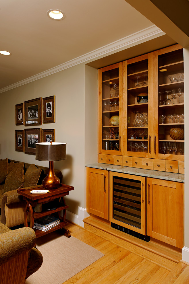 Mid-sized transitional l-shaped light wood floor and beige floor eat-in kitchen photo in DC Metro with an undermount sink, shaker cabinets, light wood cabinets, granite countertops, gray backsplash, stone tile backsplash, stainless steel appliances and an island