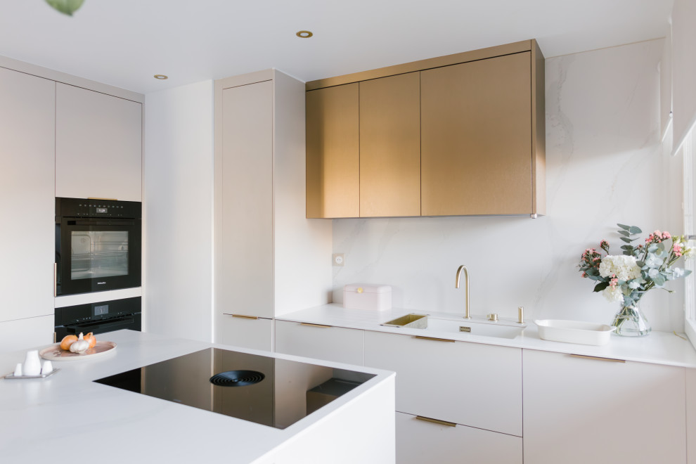 Inspiration for a medium sized scandinavian kitchen in Paris with beige cabinets, quartz worktops, white splashback, engineered quartz splashback, black appliances and white worktops.