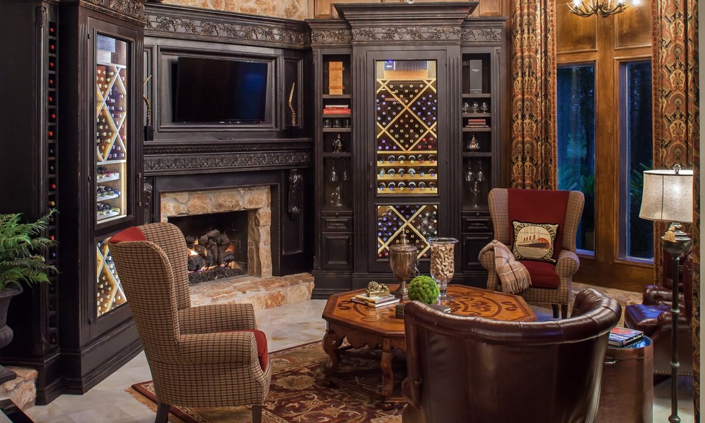 This is an example of a large traditional wine cellar in Houston with marble floors, display racks and beige floor.