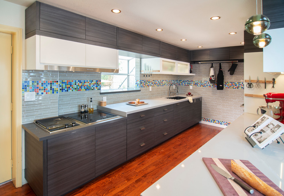 Design ideas for a contemporary galley kitchen in San Francisco with flat-panel cabinets and dark wood cabinets.