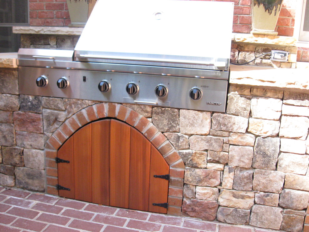 Inspiration for a mid-sized contemporary side yard stone patio kitchen remodel