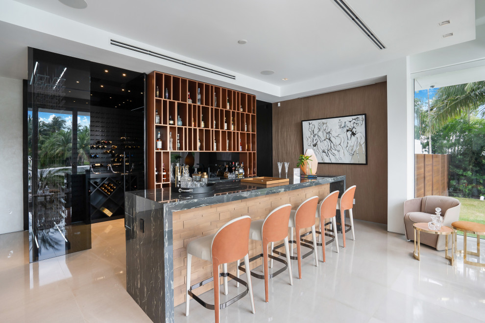This is an example of a contemporary home bar in Miami.