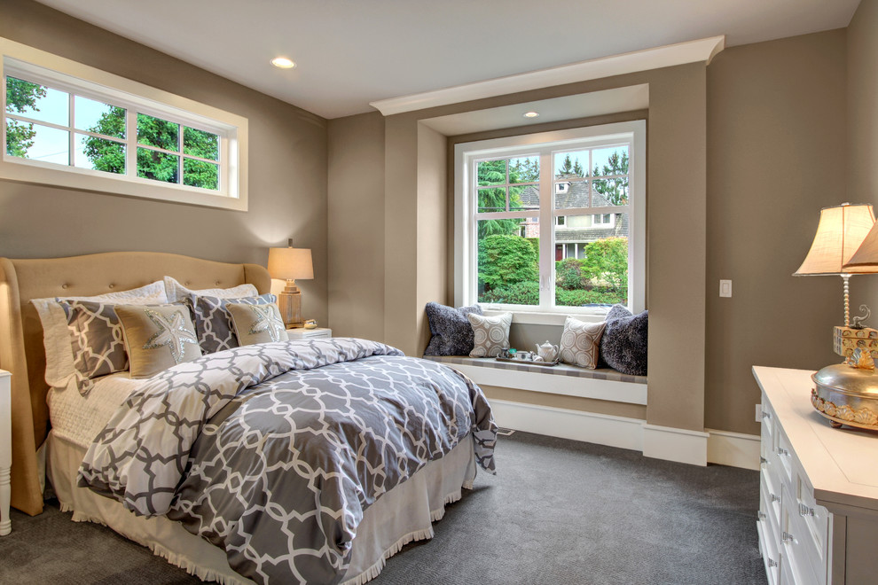 This is an example of a traditional bedroom in Seattle with brown walls, carpet and grey floor.