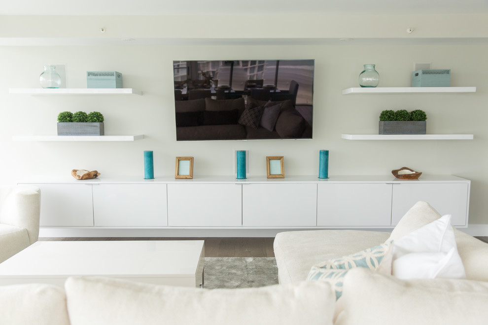 This is an example of a large modern open concept living room in San Diego with light hardwood floors, white walls, no fireplace and a wall-mounted tv.