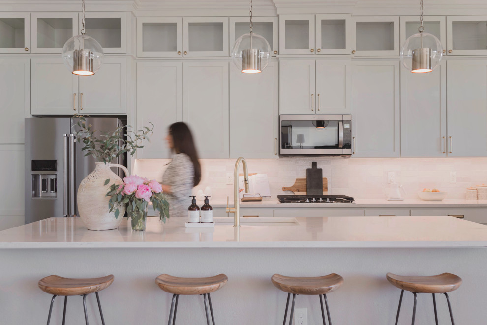 Example of a transitional kitchen design in Denver