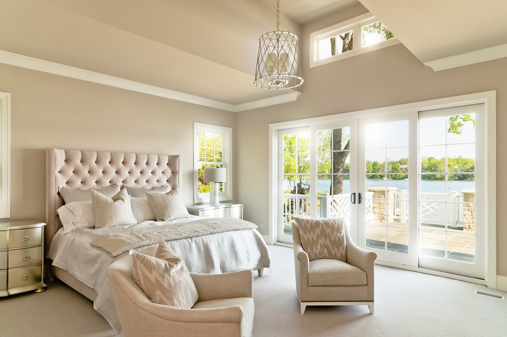 Design ideas for an expansive modern master bedroom in Detroit with beige walls, carpet, no fireplace and beige floor.