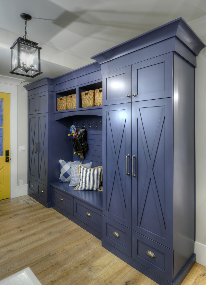 Inspiration for a mid-sized transitional mudroom in Denver with grey walls, light hardwood floors, a single front door and a yellow front door.