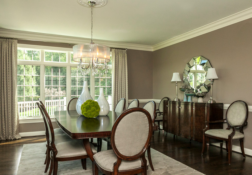 This is an example of a large transitional separate dining room in Philadelphia with brown walls and dark hardwood floors.