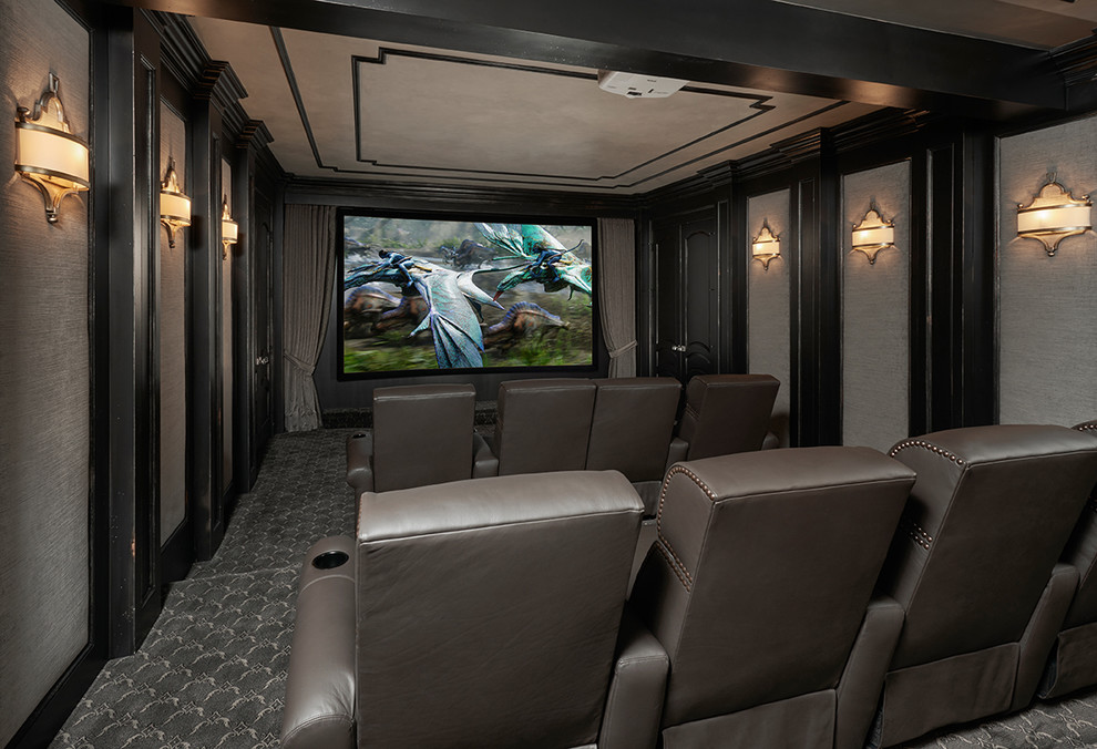 Photo of an expansive transitional enclosed home theatre in Detroit with beige walls, carpet, a projector screen and grey floor.
