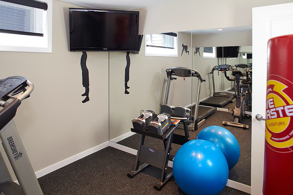 Photo of a contemporary home gym in Calgary.