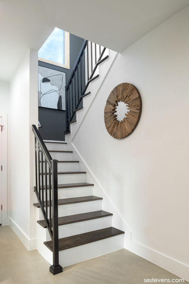 Design ideas for a small traditional wood u-shaped wood railing staircase with painted wood risers.