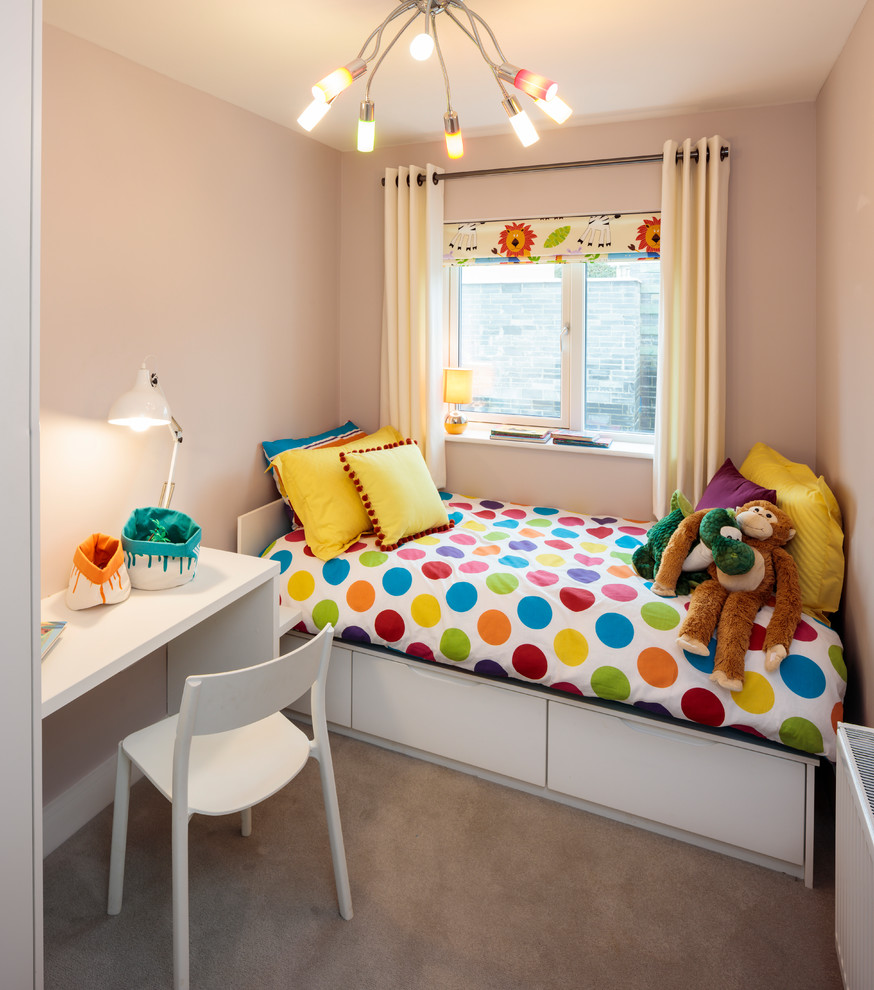 Photo of a small contemporary kids' bedroom for kids 4-10 years old and girls in Other with beige walls, carpet and grey floor.