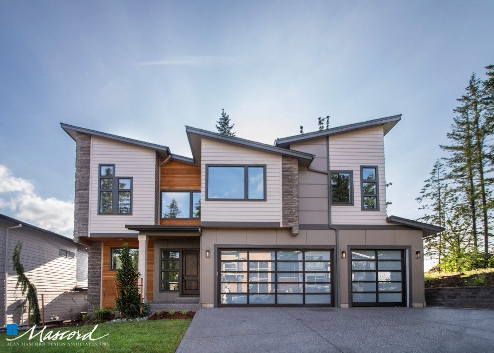 Large trendy gray two-story mixed siding house exterior photo in Portland with a shed roof and a shingle roof