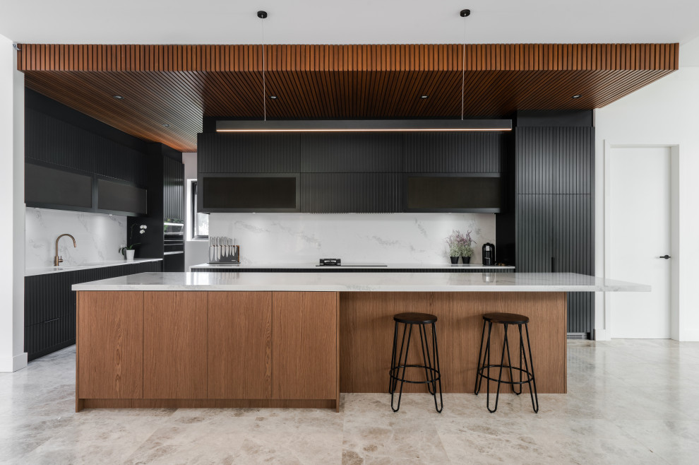 This is an example of a contemporary kitchen in Sydney with an island.