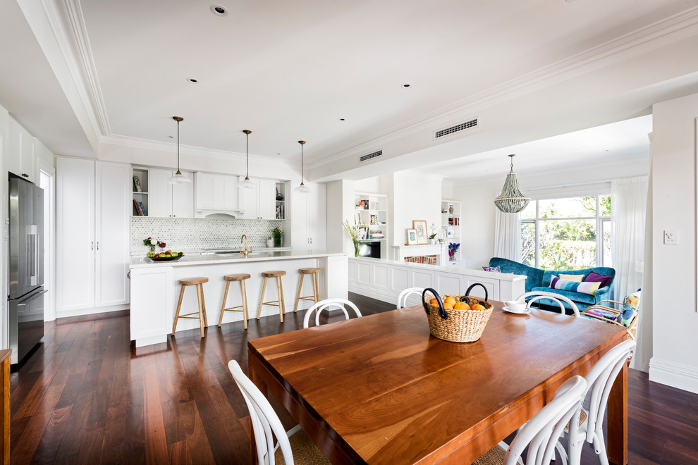 Photo of a large beach style open plan dining in Perth with white walls, medium hardwood floors and no fireplace.