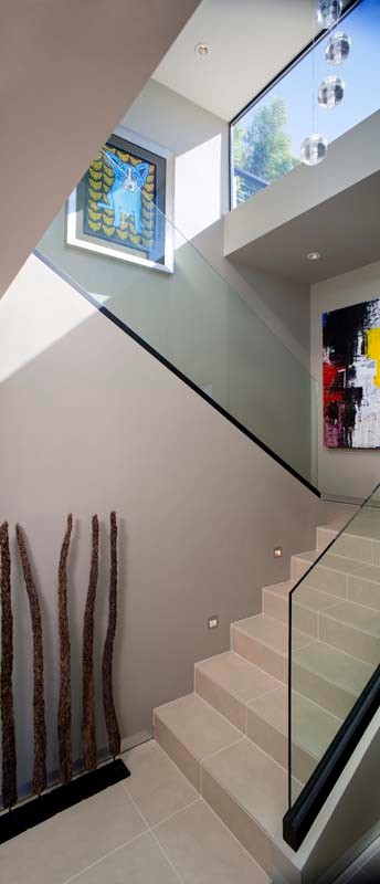 Mid-sized modern tile l-shaped staircase in San Diego with tile risers.