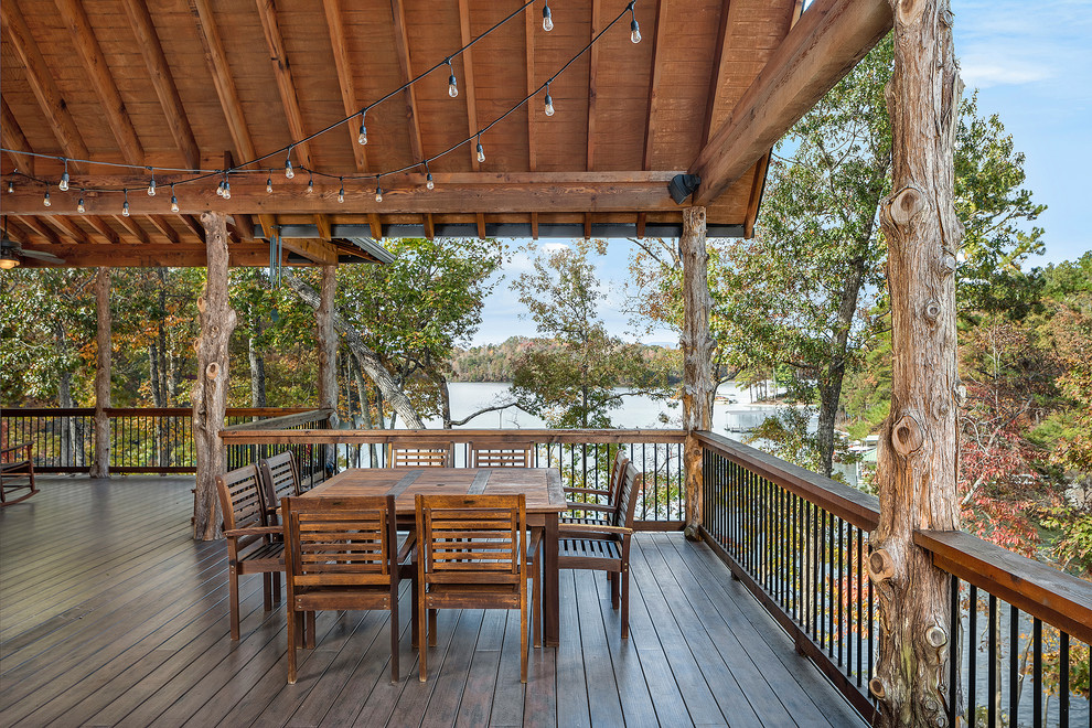 Example of a mountain style deck design with a roof extension
