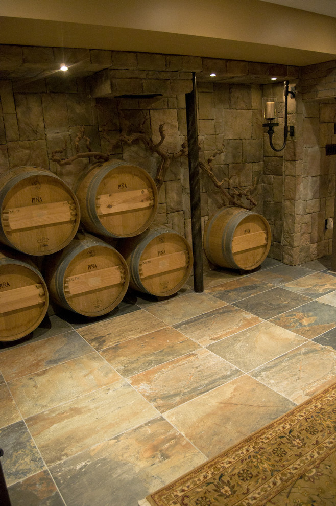 Inspiration for a mid-sized traditional wine cellar in Boston with slate floors and display racks.
