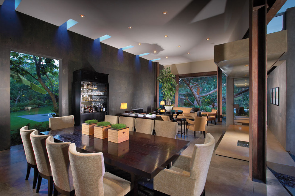 Photo of a contemporary dining room in Orange County with concrete floors.