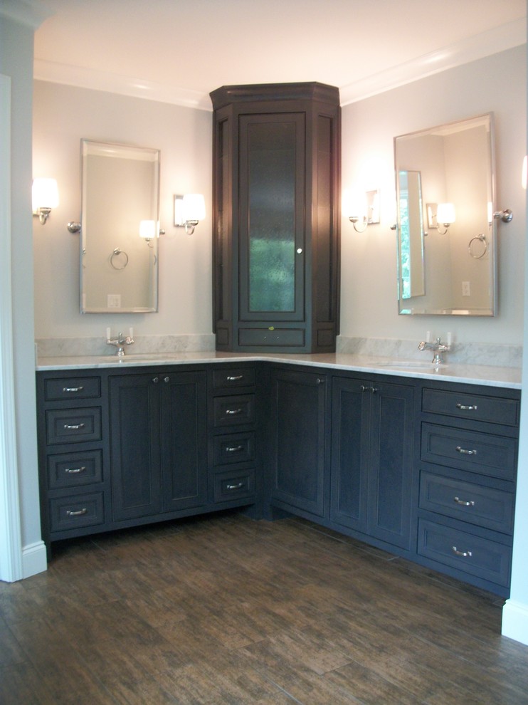 Inspiration for a traditional bathroom in Atlanta with shaker cabinets, black cabinets, grey walls, dark hardwood floors, an undermount sink, marble benchtops and brown floor.