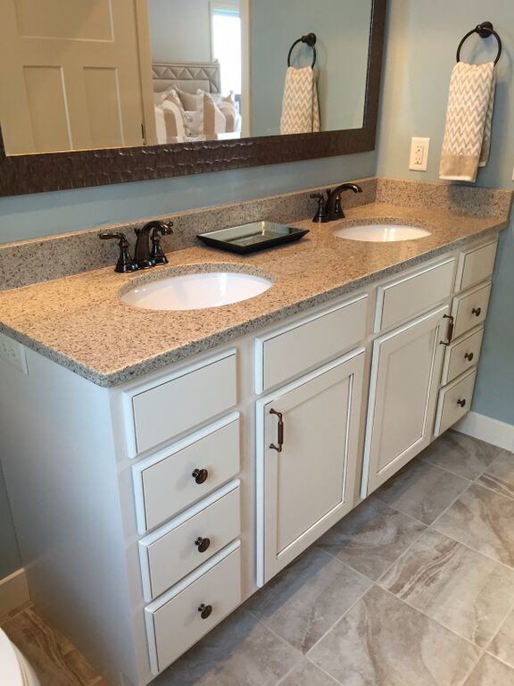Mid-sized transitional master multicolored tile and porcelain tile porcelain tile bathroom photo with recessed-panel cabinets, white cabinets, granite countertops, blue walls and an undermount sink