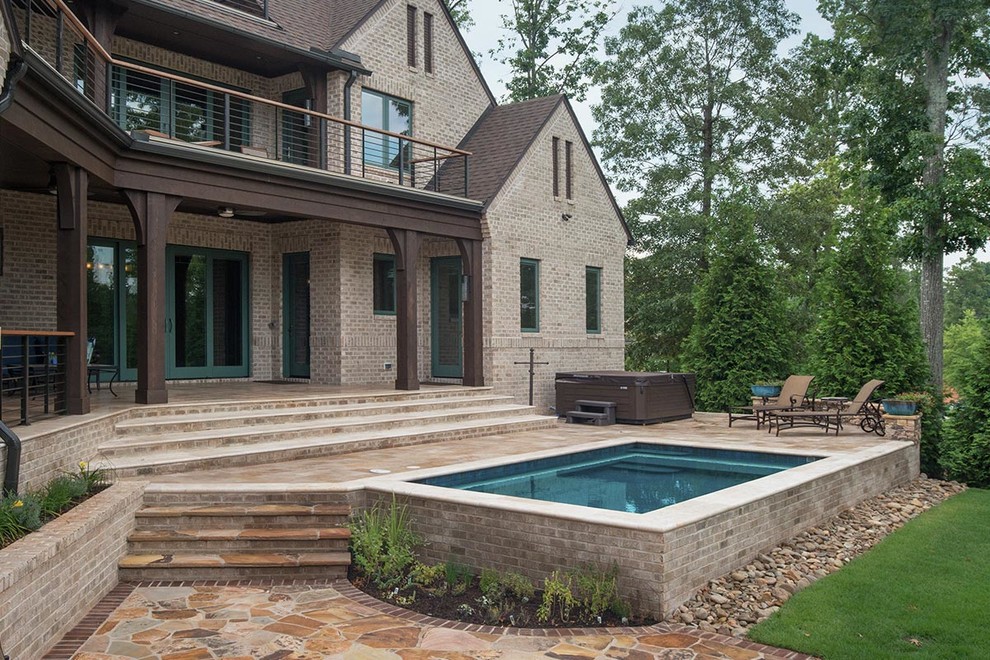 Small mountain style backyard rectangular and stone hot tub photo