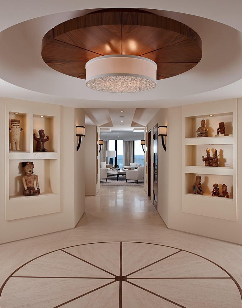 Design ideas for an expansive contemporary hallway in Miami with beige walls and limestone floors.