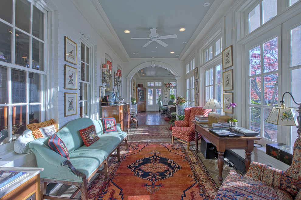 Expansive traditional hallway in DC Metro with white walls and brick floors.